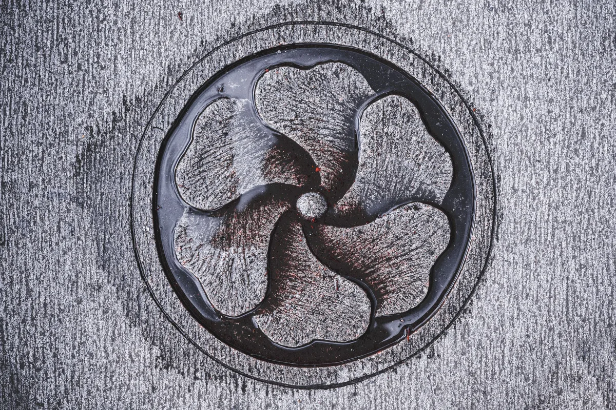 Round floor drain grate in stone